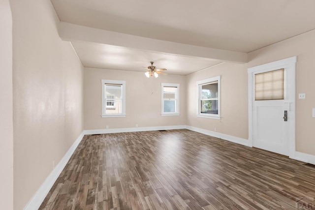 2121 N Greenwood St, Pueblo, CO 81003 - unfurnished room featuring dark wood finished floors, plenty of natural light, and a ceiling fan