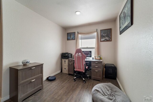 office space featuring dark wood finished floors and baseboards