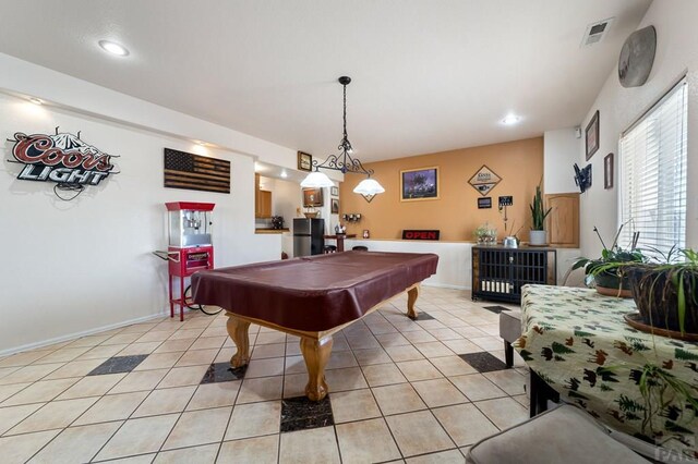 game room with pool table, visible vents, baseboards, and light tile patterned floors