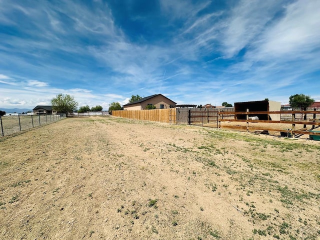 822 S Espanola Dr, Pueblo West, CO 81007 - view of yard featuring an enclosed area, an outdoor structure, and an exterior structure