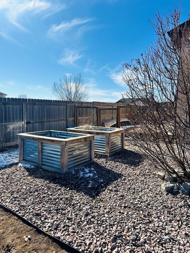 view of yard featuring a garden and fence