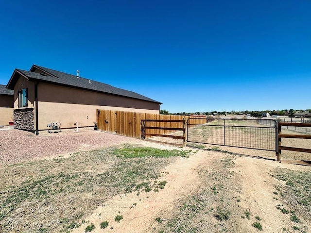 822 S Espanola Dr, Pueblo West, CO 81007 - view of side of property with fence and stucco siding