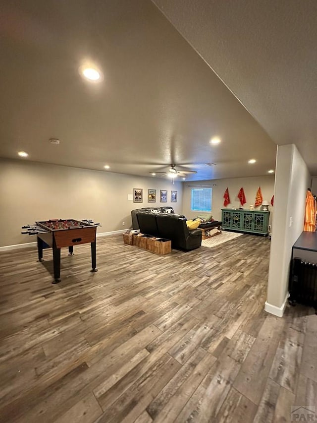 game room with baseboards, wood finished floors, and recessed lighting