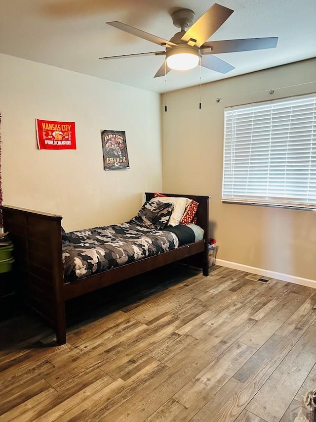 822 S Espanola Dr, Pueblo West, CO 81007 - bedroom featuring a ceiling fan, baseboards, and hardwood / wood-style flooring