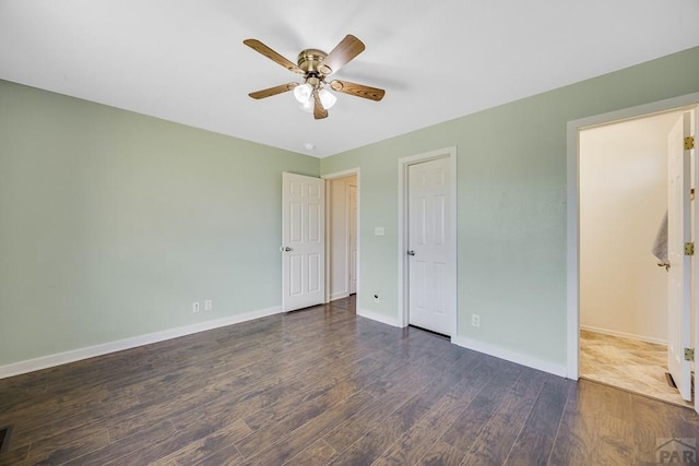 1085 E Blackstone Dr, Pueblo West, CO 81007 - unfurnished bedroom with dark wood-style floors and a ceiling fan