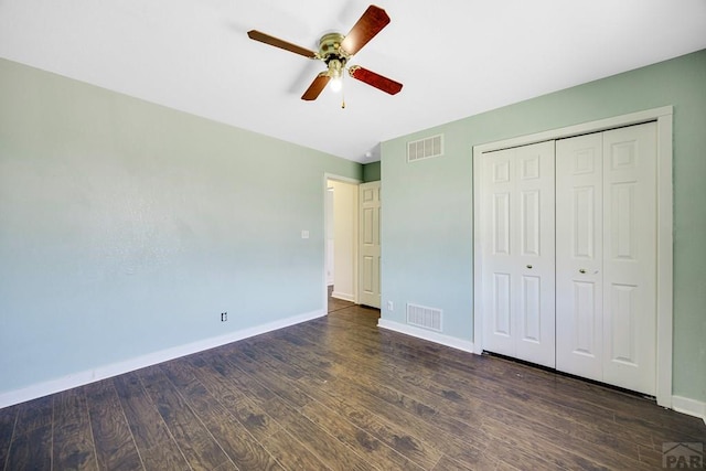 1085 E Blackstone Dr, Pueblo West, CO 81007 - unfurnished bedroom with dark wood-type flooring, a closet, and ceiling fan