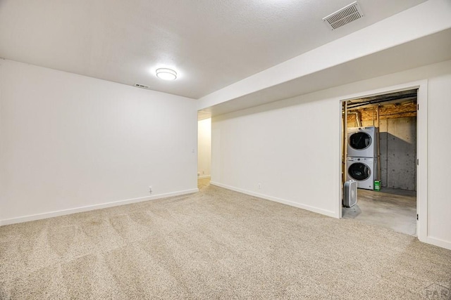 1085 E Blackstone Dr, Pueblo West, CO 81007 - basement featuring stacked washer / drying machine and carpet