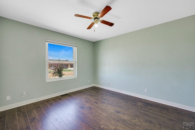 1085 E Blackstone Dr, Pueblo West, CO 81007 - empty room featuring a ceiling fan and dark wood-style flooring
