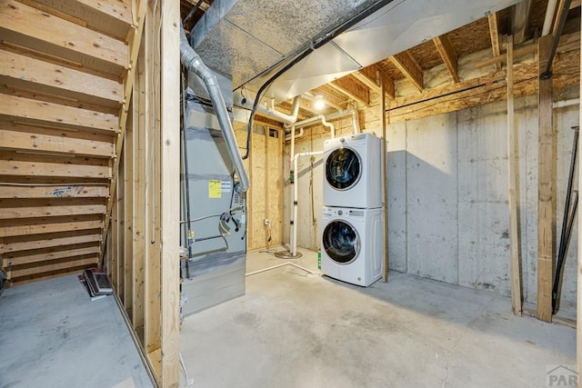 1085 E Blackstone Dr, Pueblo West, CO 81007 - unfinished basement with stacked washer and clothes dryer and heating unit