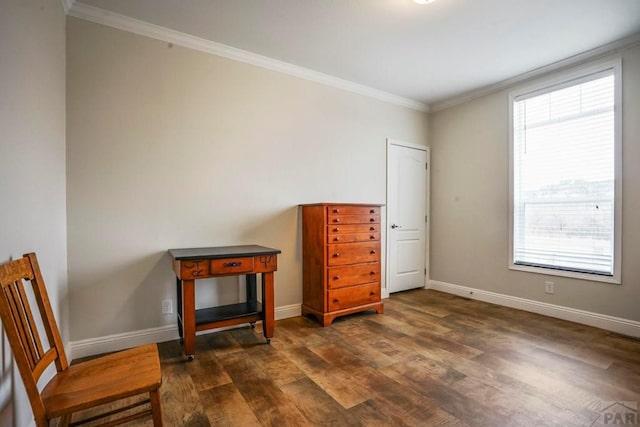 sitting room with ornamental molding, baseboards, and dark wood finished floors