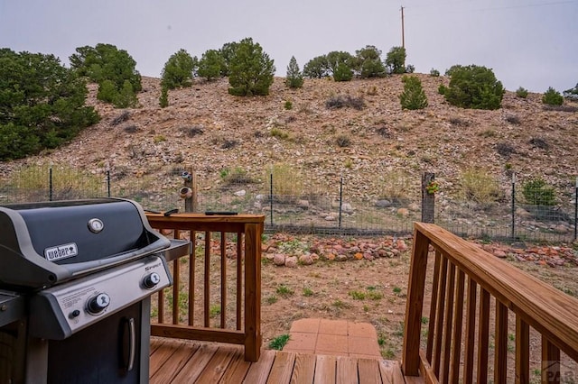 deck featuring a grill