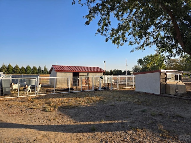 view of yard with an exterior structure and an outdoor structure