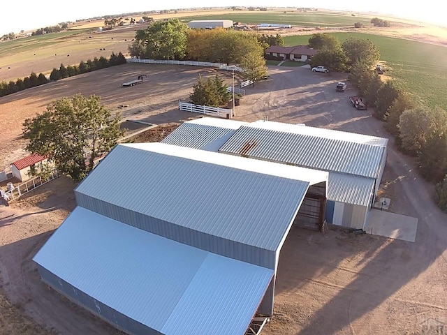 birds eye view of property featuring a rural view
