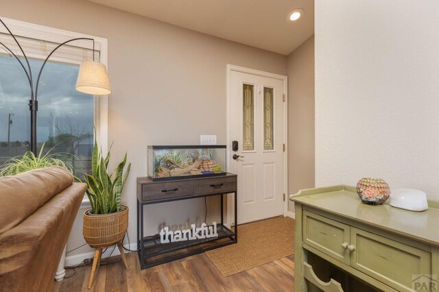 interior space with recessed lighting, baseboards, and wood finished floors