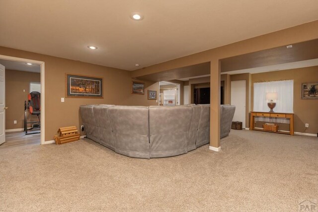 carpeted living room featuring recessed lighting and baseboards