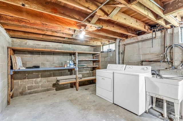 unfinished below grade area with washing machine and dryer