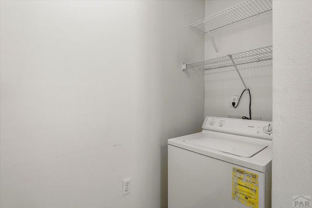 clothes washing area with laundry area and washer / clothes dryer