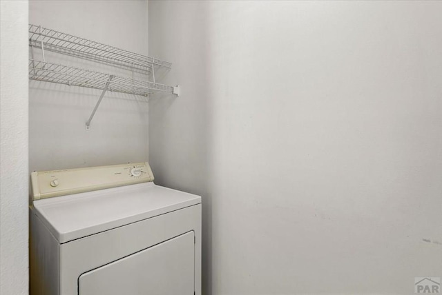 laundry room with laundry area and washer / dryer