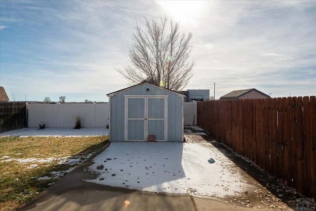 view of shed with a fenced backyard