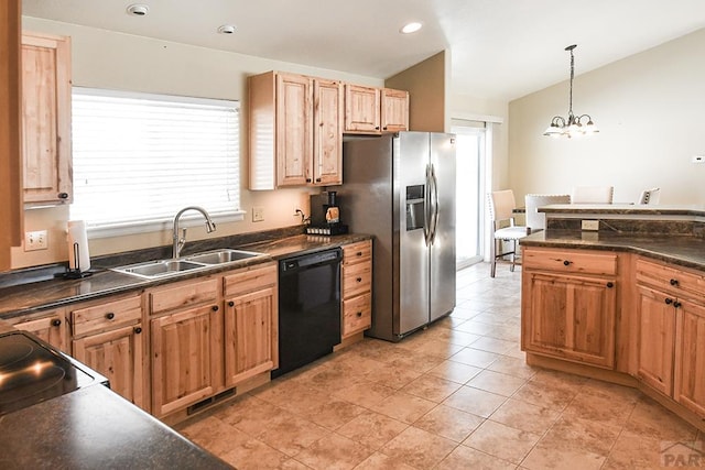 kitchen with a sink, visible vents, black dishwasher, hanging light fixtures, and dark countertops