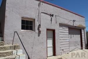 view of property exterior with a garage