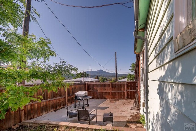 318 E Goddard Ave, Trinidad, CO 81082 - view of patio / terrace with a mountain view and area for grilling