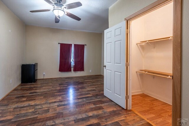318 E Goddard Ave, Trinidad, CO 81082 - unfurnished bedroom with wood finished floors and ceiling fan