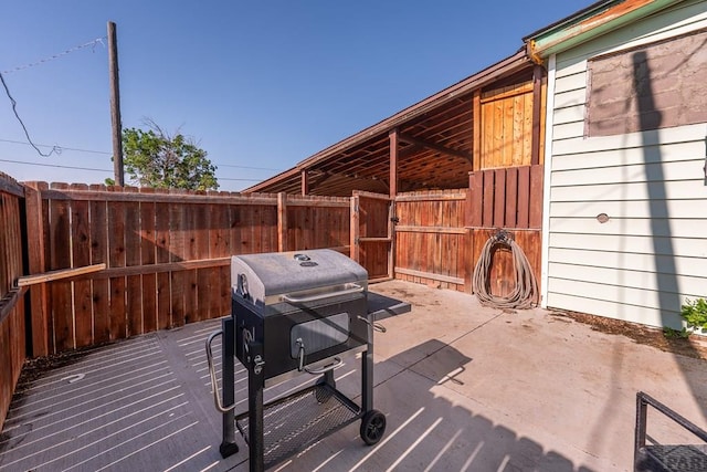 318 E Goddard Ave, Trinidad, CO 81082 - view of patio featuring an exterior structure, an outdoor structure, and a grill