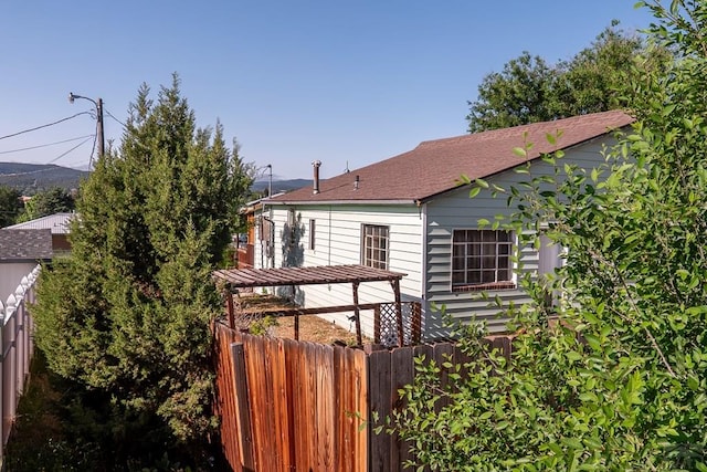 318 E Goddard Ave, Trinidad, CO 81082 - view of side of home with a shingled roof