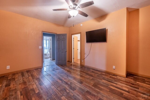 318 E Goddard Ave, Trinidad, CO 81082 - empty room featuring ceiling fan, dark wood-style floors, and baseboards