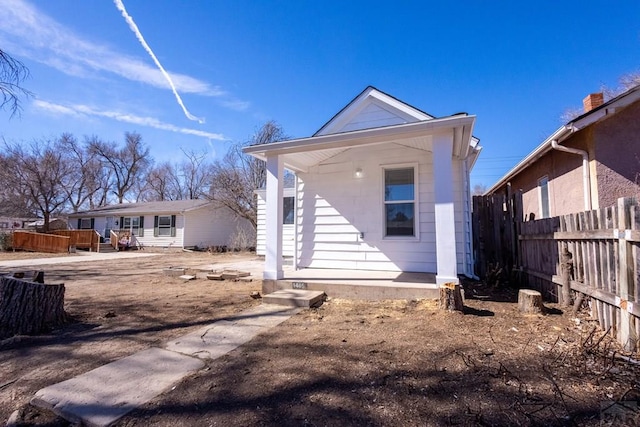 back of house with fence