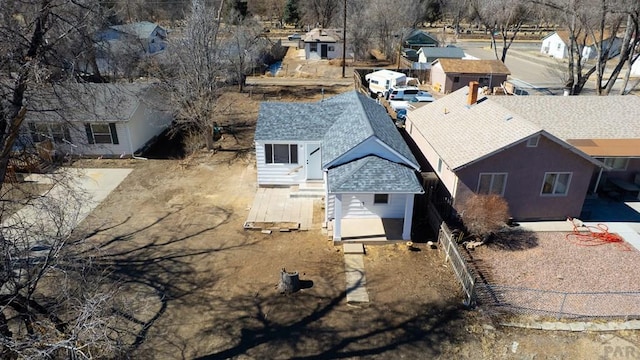 birds eye view of property with a residential view