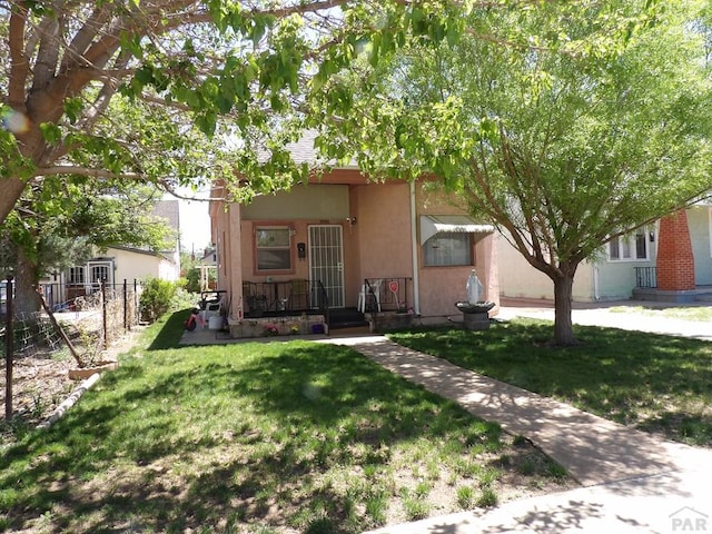 1724 E Abriendo Ave, Pueblo, CO 81004 - view of front of property with stucco siding and covered porch