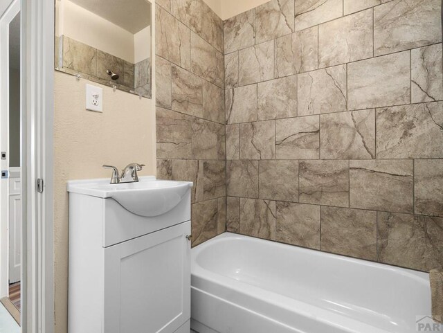 full bath with shower / washtub combination and vanity