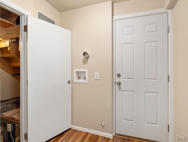 laundry room featuring laundry area, washer hookup, light wood-style flooring, and baseboards