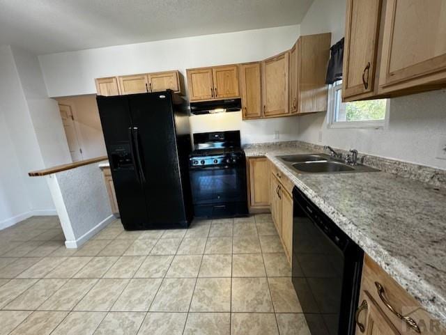 kitchen featuring light tile patterned floors, brown cabinetry, a sink, ventilation hood, and black appliances