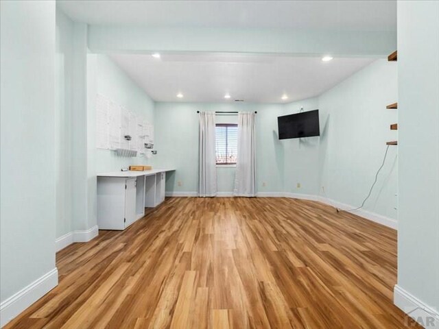 interior space featuring recessed lighting, light wood-type flooring, and baseboards