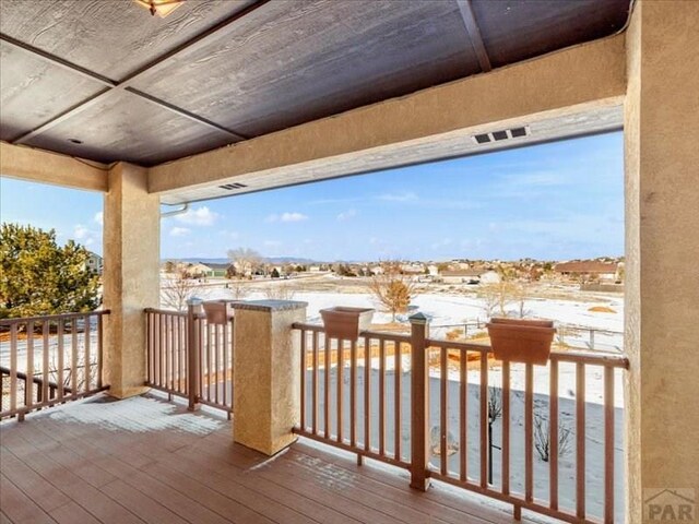 view of snow covered deck