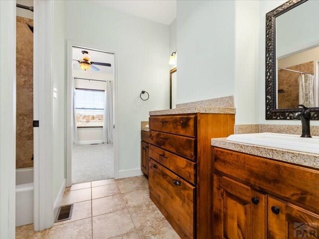 bathroom featuring visible vents, ceiling fan, vanity, and tile patterned floors