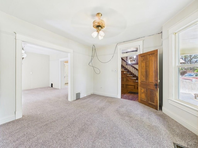 411 Michigan St, Pueblo, CO 81004 - spare room featuring carpet and stairs