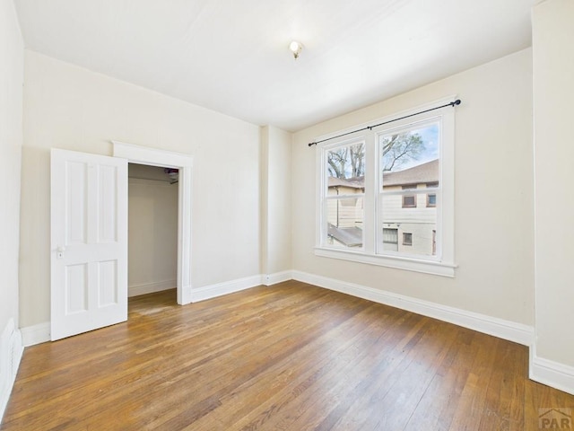 411 Michigan St, Pueblo, CO 81004 - unfurnished bedroom featuring wood-type flooring and baseboards