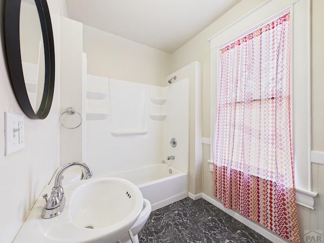 411 Michigan St, Pueblo, CO 81004 - bathroom featuring marble finish floors and shower / tub combo