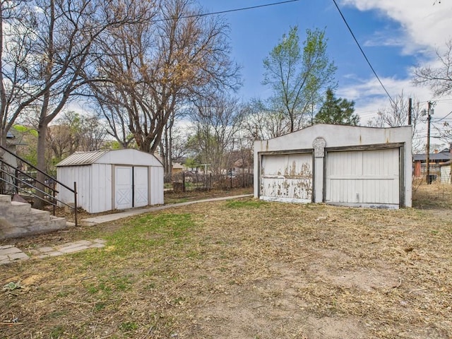 411 Michigan St, Pueblo, CO 81004 - view of yard with an outdoor structure, stairs, and a garage