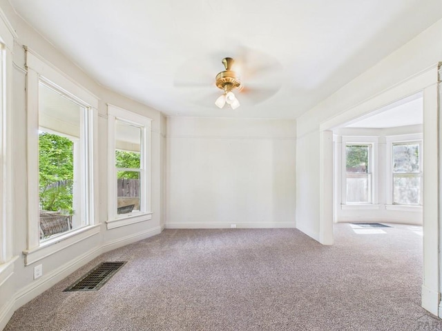 411 Michigan St, Pueblo, CO 81004 - carpeted empty room with healthy amount of natural light and ceiling fan