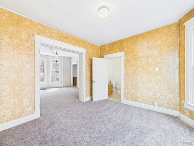 411 Michigan St, Pueblo, CO 81004 - carpeted spare room featuring wallpapered walls