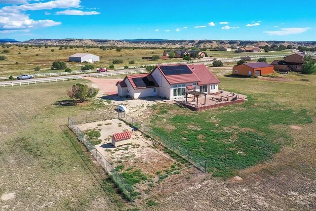 birds eye view of property featuring a rural view and a mountain view