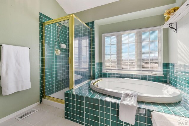 full bath featuring visible vents, a garden tub, a shower stall, and tile patterned floors