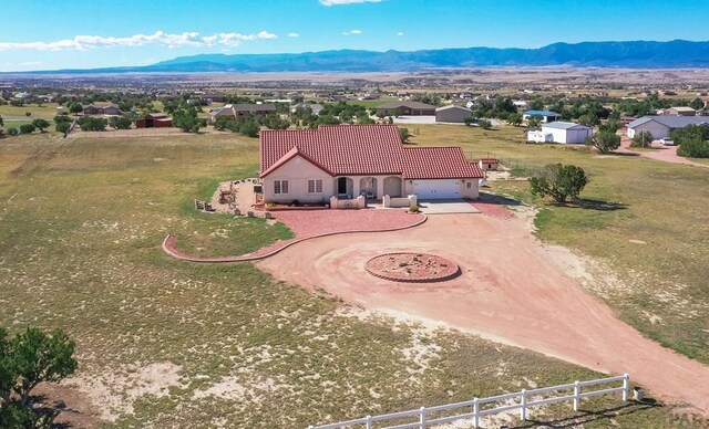 drone / aerial view featuring a mountain view