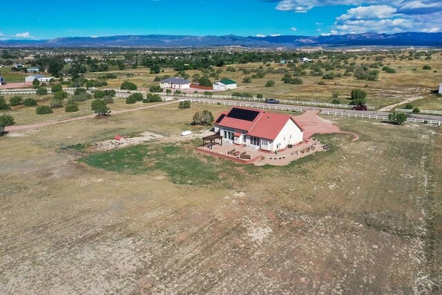 bird's eye view featuring a mountain view and a rural view