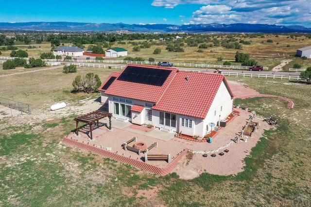 birds eye view of property with a mountain view